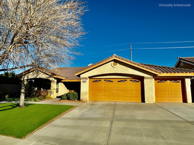 view of front facade featuring a garage and a front lawn