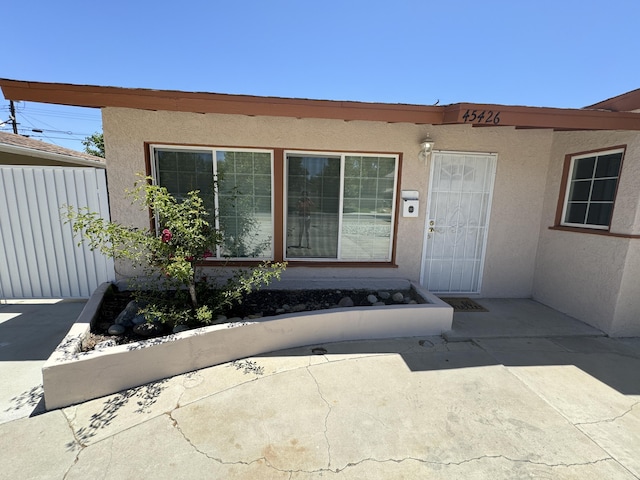 doorway to property with a patio