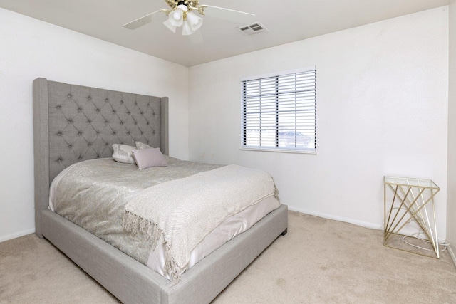 bedroom featuring ceiling fan and light carpet