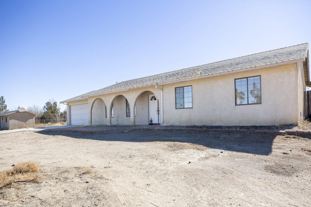 view of front of property featuring a garage