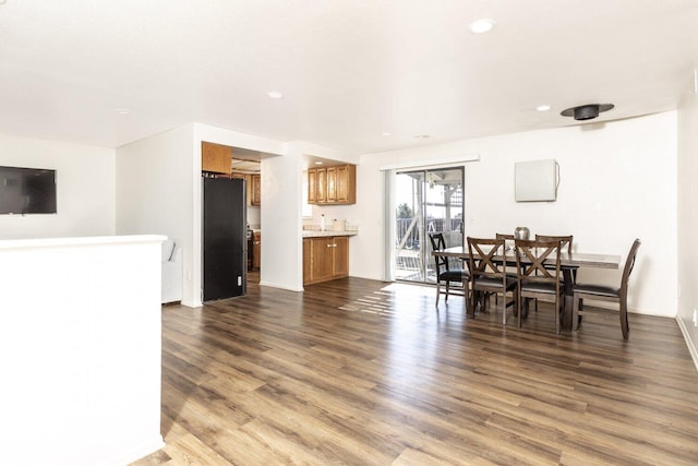 dining room with hardwood / wood-style flooring