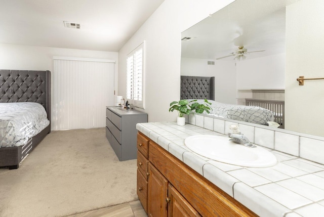 bathroom featuring vanity and ceiling fan