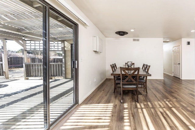 dining area featuring dark hardwood / wood-style floors