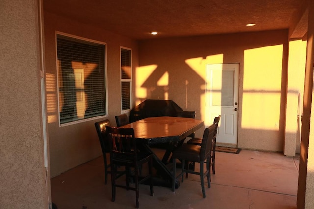 dining space with concrete floors