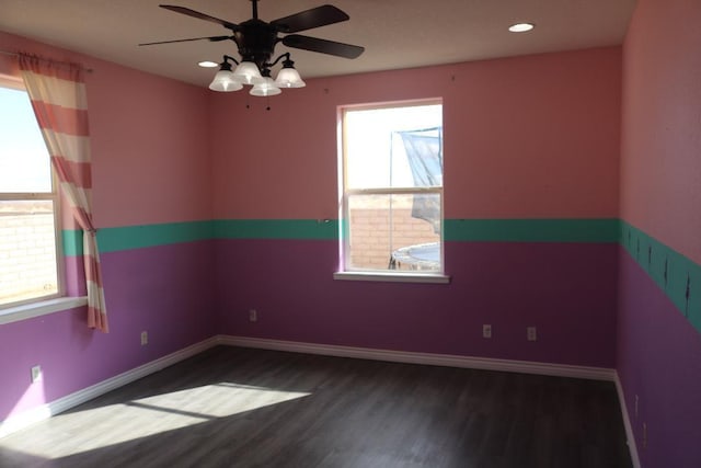 spare room with recessed lighting, wood finished floors, baseboards, and ceiling fan