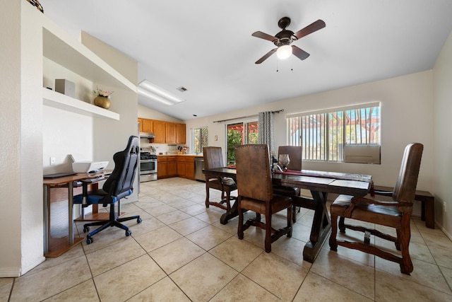 dining area with light tile patterned flooring, vaulted ceiling, visible vents, and ceiling fan