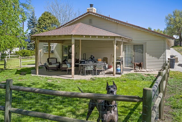 30140 Brassie Ct, Tehachapi, CA 93561 - back of property featuring a patio, a chimney, and roof with shingles