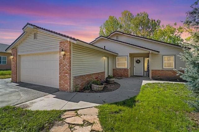 30140 Brassie Ct, Tehachapi, CA 93561 - single story home with brick siding, an attached garage, and driveway