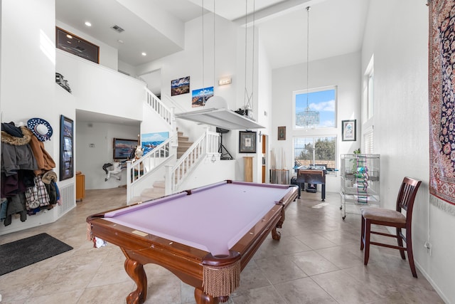 playroom with light tile patterned flooring, pool table, and a high ceiling