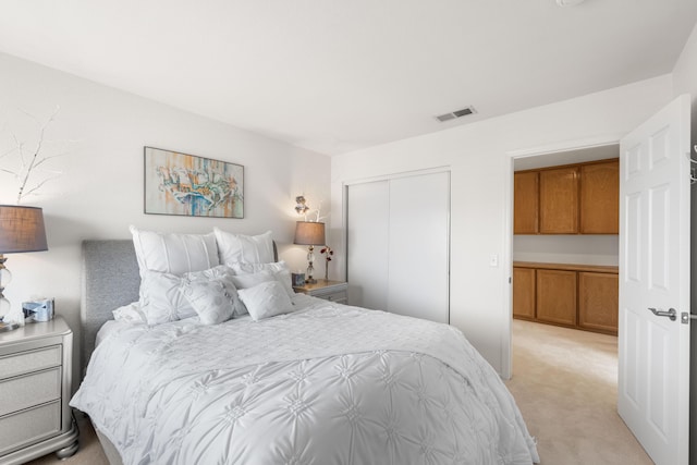 carpeted bedroom with a closet