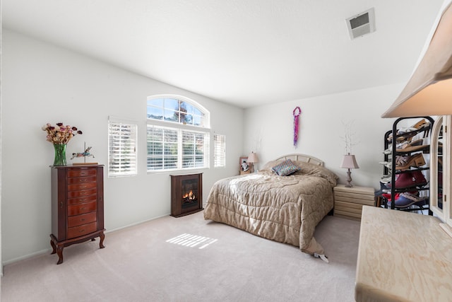 bedroom with light colored carpet