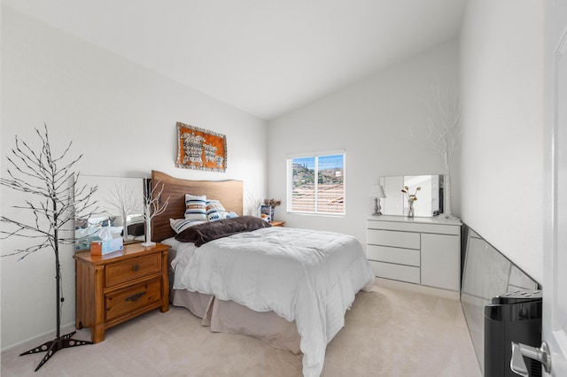 carpeted bedroom with vaulted ceiling