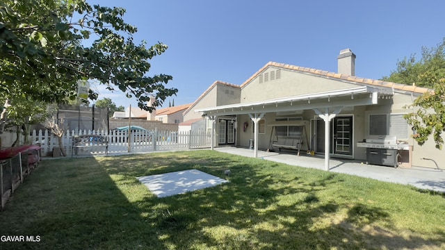 36726 Sulphur Springs Rd, Palmdale, CA 93552 - back of property with a chimney, stucco siding, and a patio