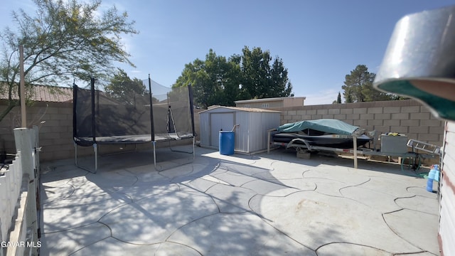 36726 Sulphur Springs Rd, Palmdale, CA 93552 - fenced backyard with a trampoline, a shed, and a patio