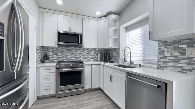 36726 Sulphur Springs Rd, Palmdale, CA 93552 - kitchen featuring stainless steel appliances, open shelves, tasteful backsplash, light countertops, and recessed lighting