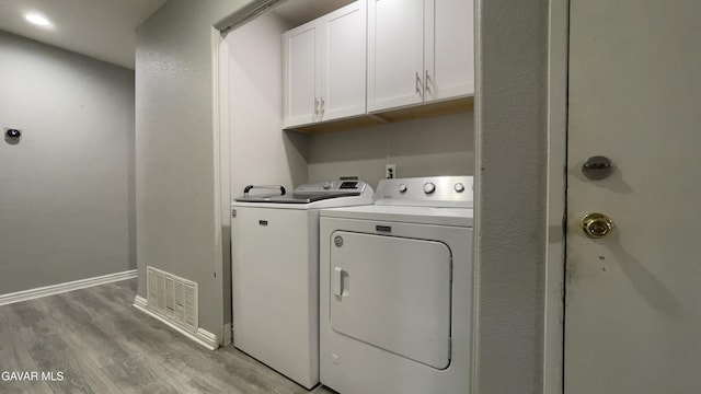36726 Sulphur Springs Rd, Palmdale, CA 93552 - laundry area with light wood finished floors, separate washer and dryer, and cabinet space