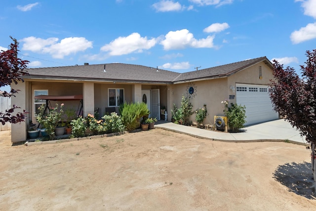 ranch-style home featuring ac unit and a garage