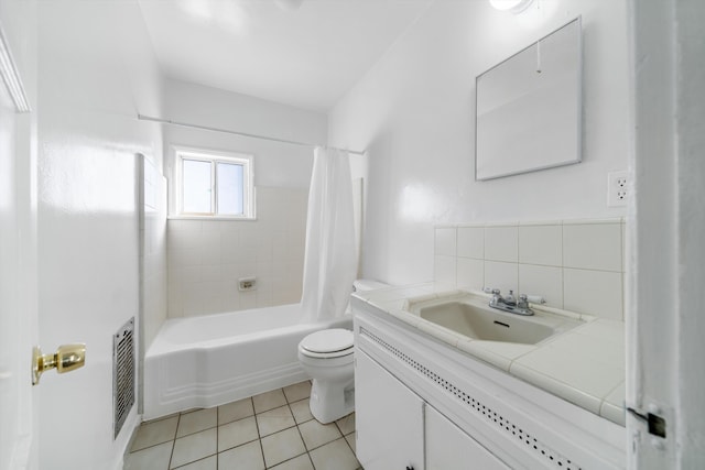 full bathroom with vanity, toilet, tile patterned floors, visible vents, and shower / bath combo with shower curtain