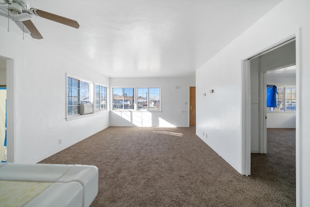 living room with cooling unit, carpet, and ceiling fan