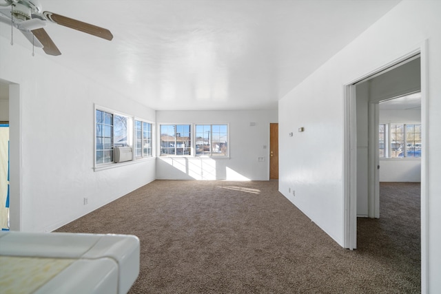 carpeted living room featuring ceiling fan and cooling unit