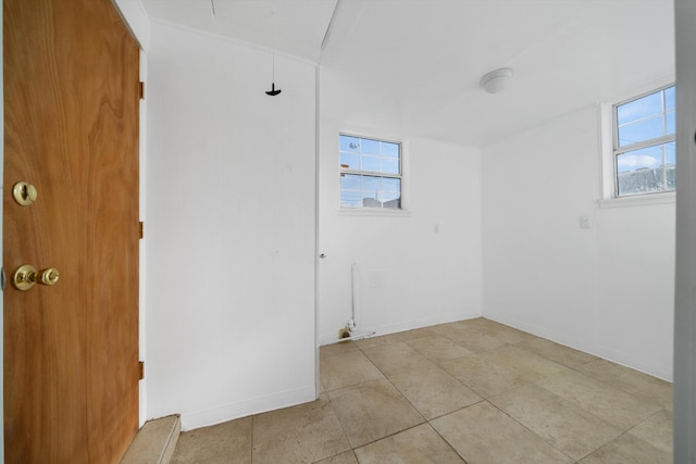 empty room featuring baseboards