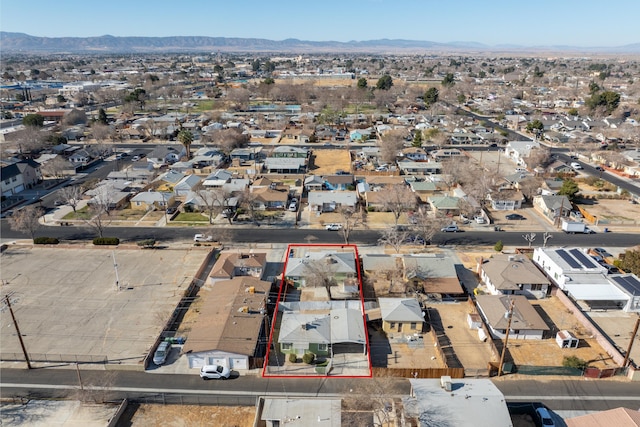drone / aerial view with a residential view and a mountain view