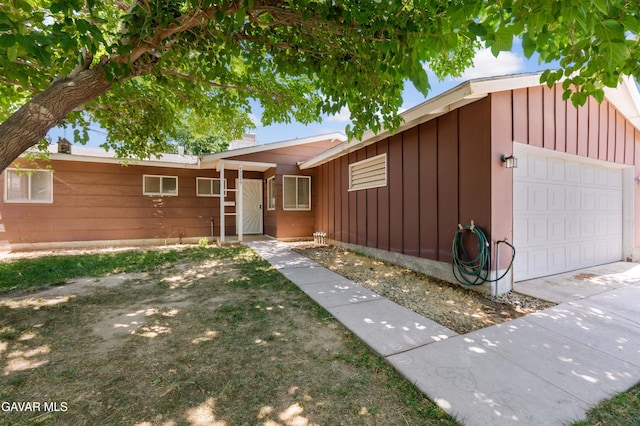 44049 Elm Ave, Lancaster, CA 93534 - ranch-style home with board and batten siding and a garage