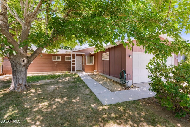 44049 Elm Ave, Lancaster, CA 93534 - single story home featuring board and batten siding and a garage