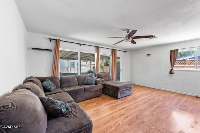 44049 Elm Ave, Lancaster, CA 93534 - living room with a ceiling fan, light wood finished floors, and a textured ceiling