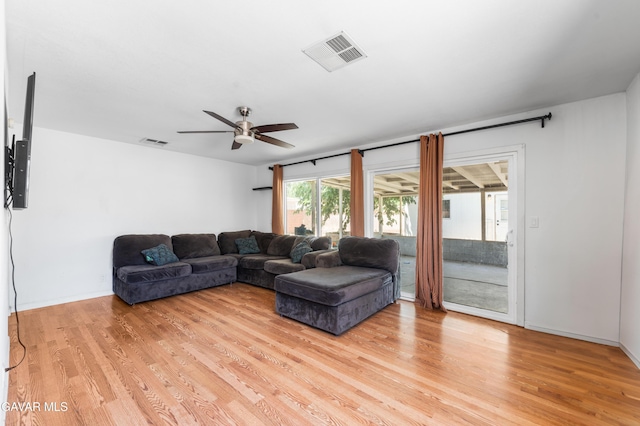 44049 Elm Ave, Lancaster, CA 93534 - living room with light wood-style flooring and a ceiling fan