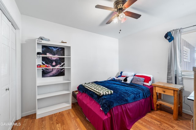 44049 Elm Ave, Lancaster, CA 93534 - bedroom with wood finished floors, a closet, and a ceiling fan