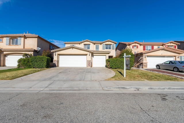 view of front of property featuring a garage and a front yard