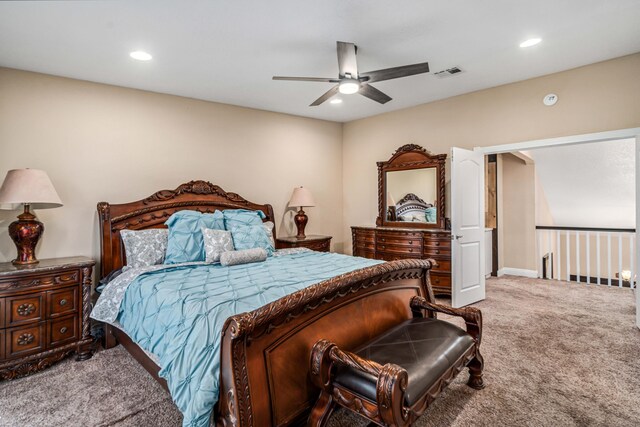carpeted bedroom featuring ceiling fan, visible vents, and recessed lighting