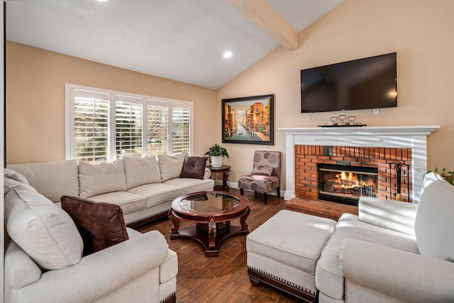 living area featuring vaulted ceiling with beams, recessed lighting, a brick fireplace, wood finished floors, and baseboards