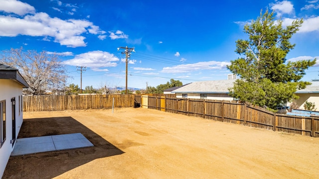 view of yard with a fenced backyard