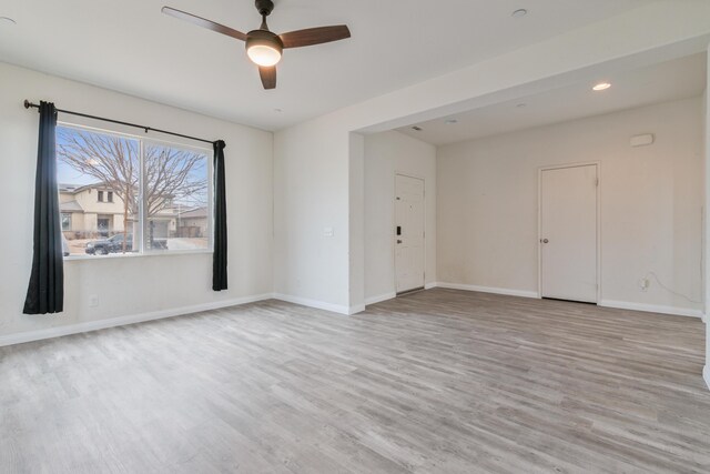 living room featuring ceiling fan and light carpet