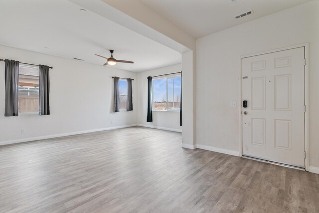 kitchen featuring light stone countertops, appliances with stainless steel finishes, and sink