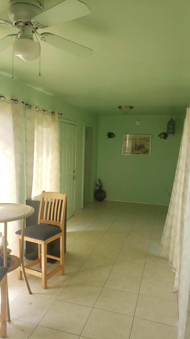 hallway featuring light tile patterned floors