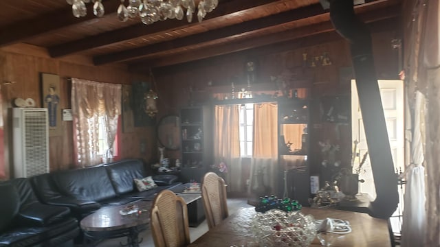 miscellaneous room featuring wood walls, beamed ceiling, and wooden ceiling