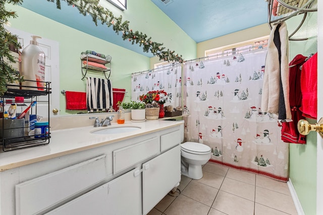 bathroom with tile patterned floors, vanity, vaulted ceiling, and a shower with curtain