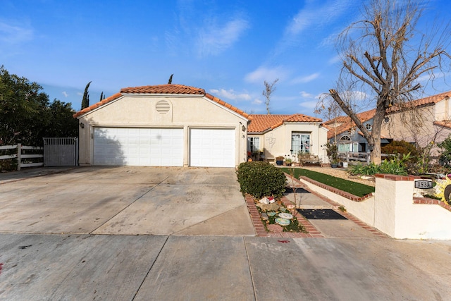 mediterranean / spanish-style house featuring a garage