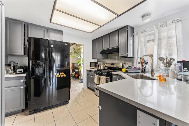 kitchen with gray cabinets, sink, and appliances with stainless steel finishes