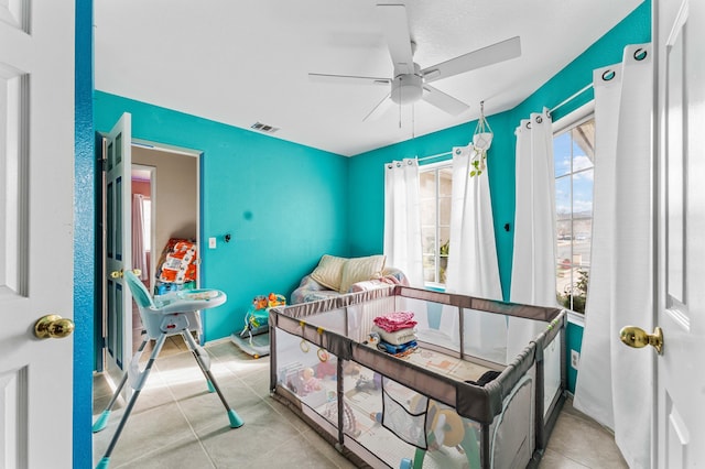 bedroom featuring ceiling fan and light tile patterned floors