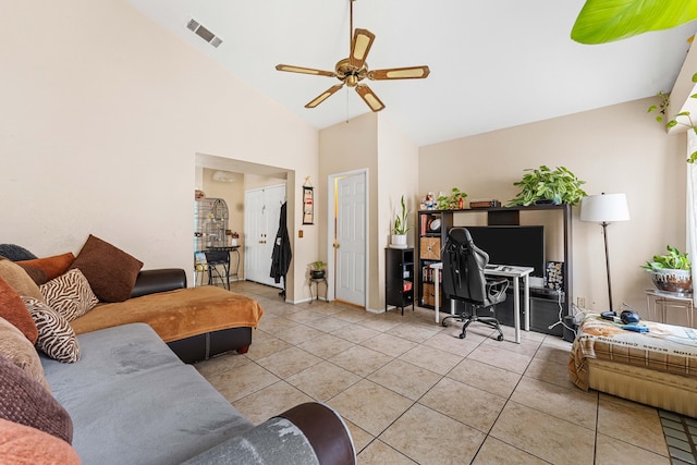 tiled living room featuring ceiling fan and high vaulted ceiling