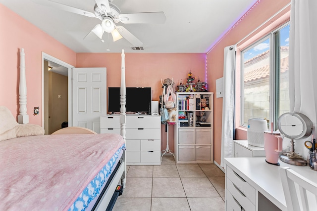 tiled bedroom featuring ceiling fan