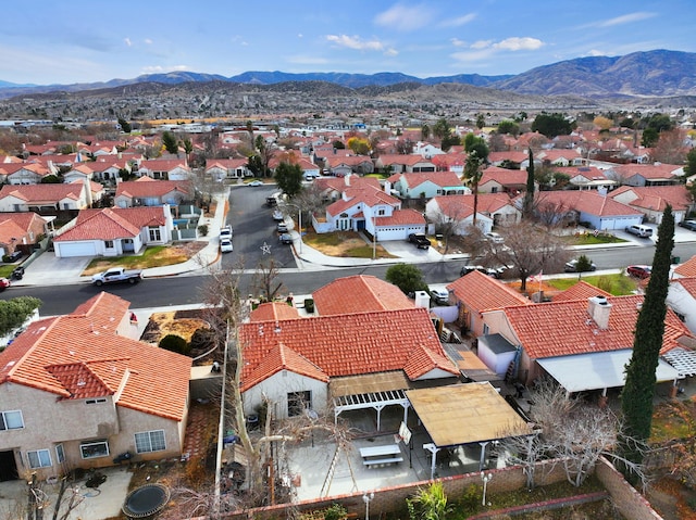 birds eye view of property with a mountain view