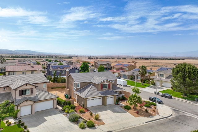 aerial perspective of suburban area featuring a mountainous background