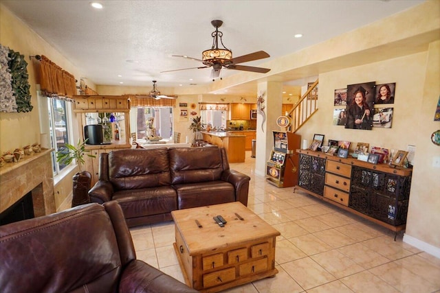 41904 Tucson Ct, Palmdale, CA 93551 - living area with ceiling fan, light tile patterned flooring, stairs, recessed lighting, and baseboards