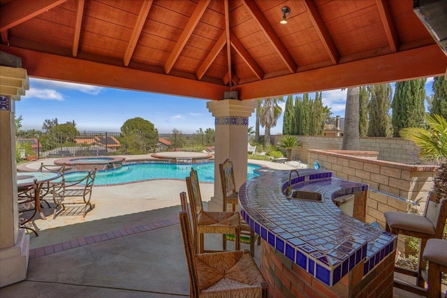 41904 Tucson Ct, Palmdale, CA 93551 - fenced backyard featuring a sink, a patio area, and a pool with connected hot tub