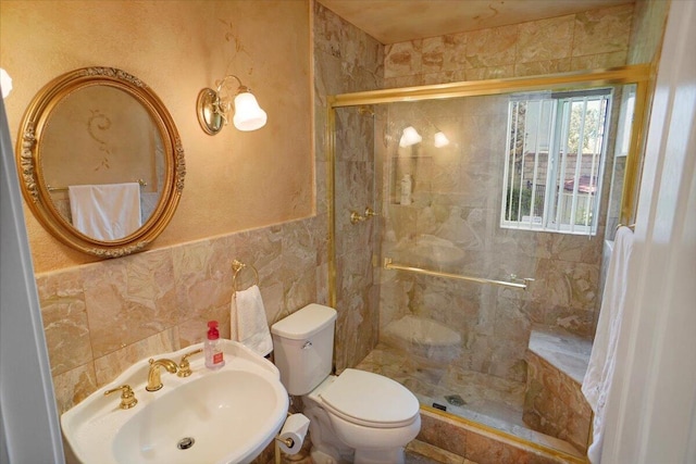 41904 Tucson Ct, Palmdale, CA 93551 - bathroom featuring toilet, a stall shower, a sink, and tile walls